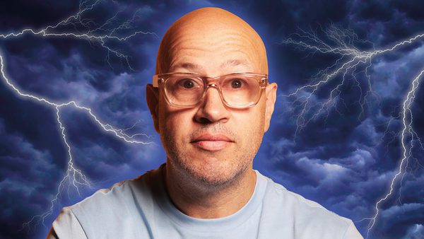 A person standing against a backdrop of dark, stormy clouds with visible lightning bolts.