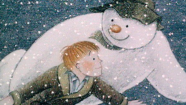 Child in winter clothing interacting with a snowman wearing a hat, carrot nose, coal eyes, and a smile, surrounded by falling snowflakes in a wintry scene.