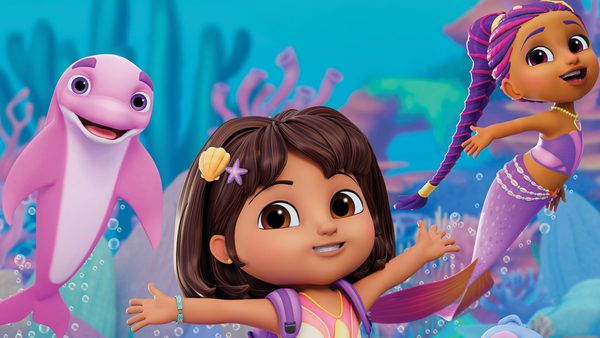 An animated underwater scene with a smiling child in a pink outfit and seashell hair clip, a cheerful pink dolphin, and a colorful mermaid character with braided hair, surrounded by coral reefs and bubbles.