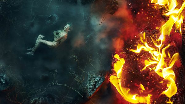 Surreal scene featuring a person lying on the left side, surrounded by dark, smokey, and watery elements, contrasted by bright flames and fiery textures on the right side.