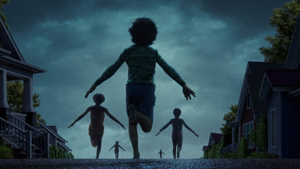A group of silhouetted children running down a suburban street at twilight, with dark clouds overhead and house lights glowing, creating a dramatic and mysterious atmosphere.