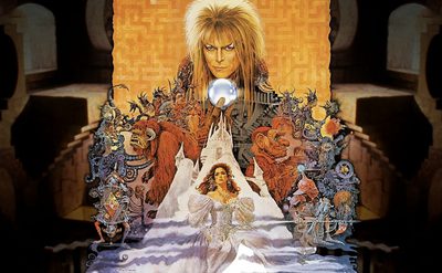 A fantasy-style poster for the film “Labyrinth,” showing a man with wild blond hair holding a crystal ball above a castle. Below are magical creatures and a girl in a white dress.