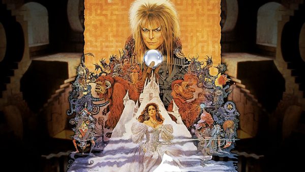 A fantasy-style poster for the film “Labyrinth,” showing a man with wild blond hair holding a crystal ball above a castle. Below are magical creatures and a girl in a white dress.